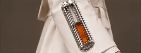 Chrome turn-signal lamp on the suit sleeve